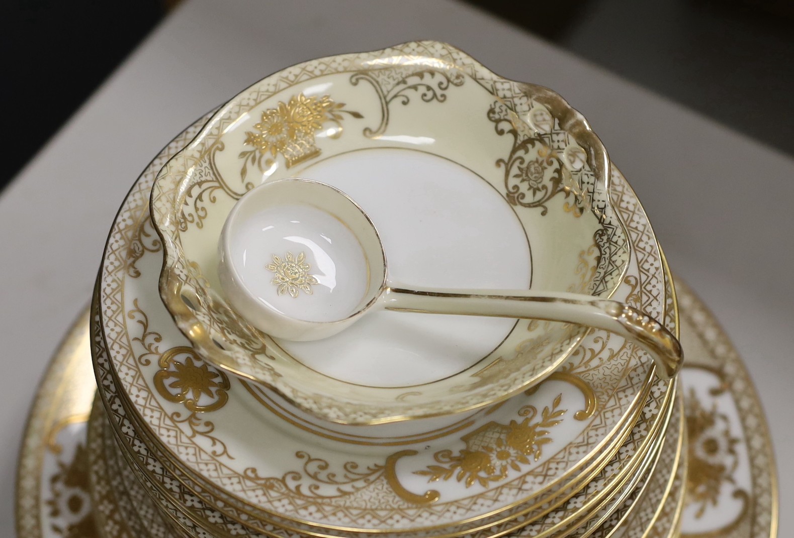 A Noritake gilt bordered dinner service